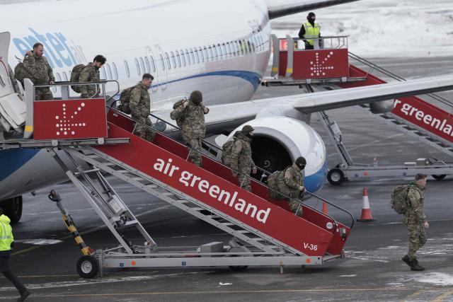 Military personnel believed to be from the German armed Forces Bundeswehr disembark a charter plane upon arrival at Nuuk international airport on January 16, 2026 in Nuuk, Greenland, the day after it arrived transporting Danish military personnel. Denmark's prime minister said on January 15, 2026 that the US ambition to take control of Greenland remained "intact" and that there were still a "fundamental disagreement" between the countries, despite high-stakes White House talks. (Photo by Alessandro Rampazzo / AFP)