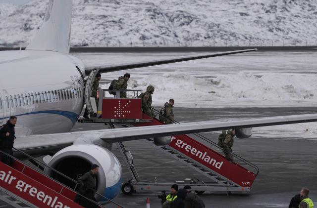 Military personnel believed to be from the German armed Forces Bundeswehr disembark a charter plane upon arrival at Nuuk international airport on January 16, 2026 in Nuuk, Greenland, the day after it arrived transporting Danish military personnel. Denmark's prime minister said on January 15, 2026 that the US ambition to take control of Greenland remained "intact" and that there were still a "fundamental disagreement" between the countries, despite high-stakes White House talks. (Photo by Alessandro Rampazzo / AFP)