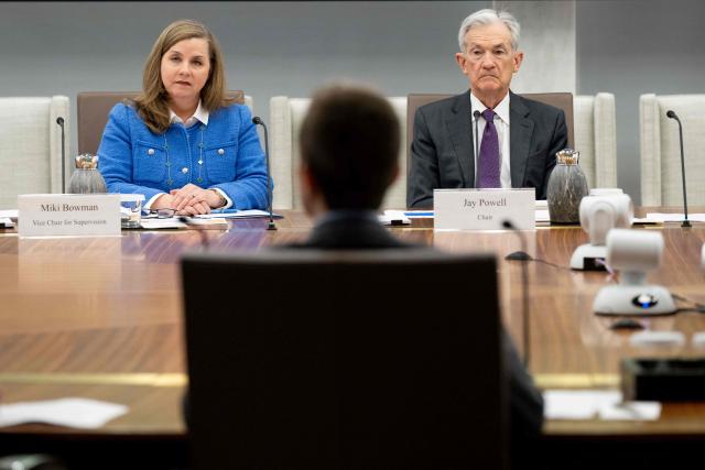 (FILES) Chairman of the US Federal Reserve Jerome Powell sits alongside Michelle Bowman (L), Vice Chair for Supervision, as he chairs a Federal Reserve Board open meeting discussing proposed revisions to the board's supplementary leverage ratio standards at the Federal Reserve Board building in Washington, DC, on June 25, 2025. Bowman, a key US Federal Reserve, said on January 16, 2026, that central bank policymakers should be ready to lower interest rates further, citing "fragility" in the jobs market. "Absent a clear and sustained improvement in labor market conditions, we should remain ready to adjust policy to bring it closer to neutral," said Bowman, the Fed's vice chair for supervision. (Photo by SAUL LOEB / AFP)