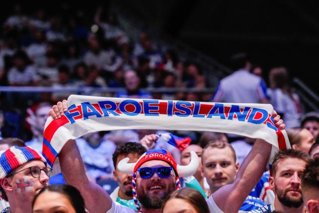 Faroe Islands fans cheer prior to the men's EHF Euro 2026 preliminary round handball match Faroe Islands vs Switzerland at the Unity Arena in Fornebu near Oslo on January 16, 2026. (Photo by Cornelius Poppe / NTB / AFP) / Norway OUT