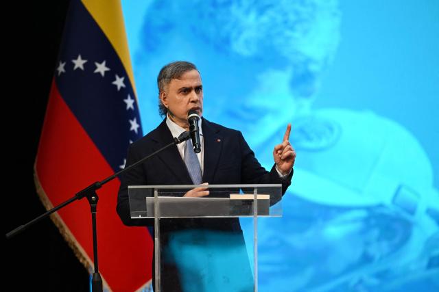 Venezuela's Attorney General Tarek William Saab speaks during a forum organized by the "Network of Lawyers for the Release of President Nicolas Maduro and First Lady Cilia Flores" at the Teresa Carreno Theater in Caracas on January 16, 2026. US Central Intelligence Agency chief John Ratcliffe met Venezuela's interim leader Delcy Rodriguez in Caracas on January 15, a US administration official said, in the highest-level American visit since the fall of Nicolas Maduro. (Photo by Federico PARRA / AFP)