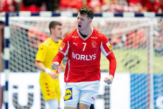 Denmark's wing #07 Emil Manfeldt Jakobsen celebrates scoring during the men's EHF Euro 2026 preliminary round group B handball match Denmark vs North Macedonia in Herning, Denmark, on January 16, 2026. (Photo by Bo Amstrup / Ritzau Scanpix / AFP) / Denmark OUT