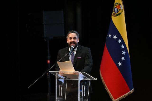 Deputy Nicolas Maduro Guerra speaks during a forum organized by the "Network of Lawyers for the Release of President Nicolas Maduro and First Lady Cilia Flores" at the Teresa Carreno Theater in Caracas on January 16, 2026. US Central Intelligence Agency chief John Ratcliffe met Venezuela's interim leader Delcy Rodriguez in Caracas on January 15, a US administration official said, in the highest-level American visit since the fall of Nicolas Maduro. (Photo by Federico PARRA / AFP)