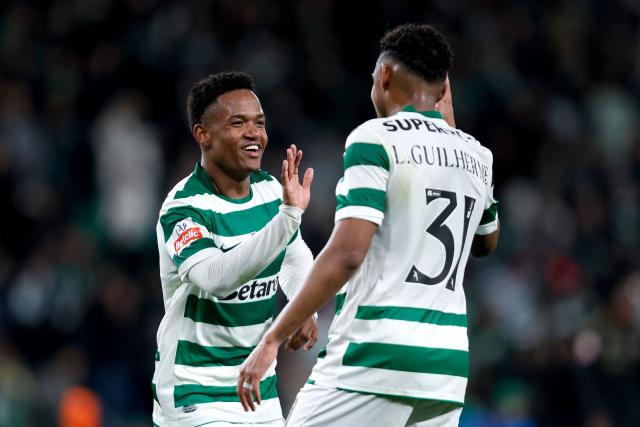 Sporting Lisbon's Mozambican forward #10 Geny Catamo (L) celebrates with teammate Brazilian forward #31 Luis Guilherme (R) after scoring his team's first goal during the Portuguese League football match between Sporting CP and Casa Pia AC at Jose Alvalade stadium in Lisbon on January 16, 2026. (Photo by Filipe AMORIM / AFP)