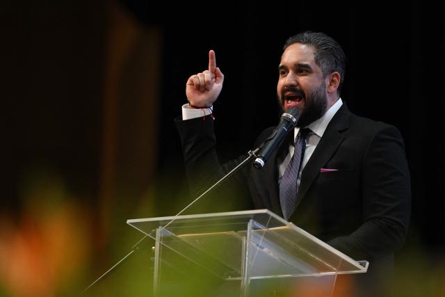 Deputy Nicolas Maduro Guerra speaks during a forum organized by the "Network of Lawyers for the Release of President Nicolas Maduro and First Lady Cilia Flores" at the Teresa Carreno Theater in Caracas on January 16, 2026. US Central Intelligence Agency chief John Ratcliffe met Venezuela's interim leader Delcy Rodriguez in Caracas on January 15, a US administration official said, in the highest-level American visit since the fall of Nicolas Maduro. (Photo by Federico PARRA / AFP)