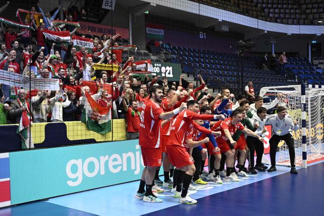 Hungary's players celebrate winning the men's EHF Euro 2026 preliminary round group F handball match Hungary vs Poland in Kristianstad, Sweden, on January 16, 2026. (Photo by Johan Nilsson/TT / TT NEWS AGENCY / AFP) / Sweden OUT