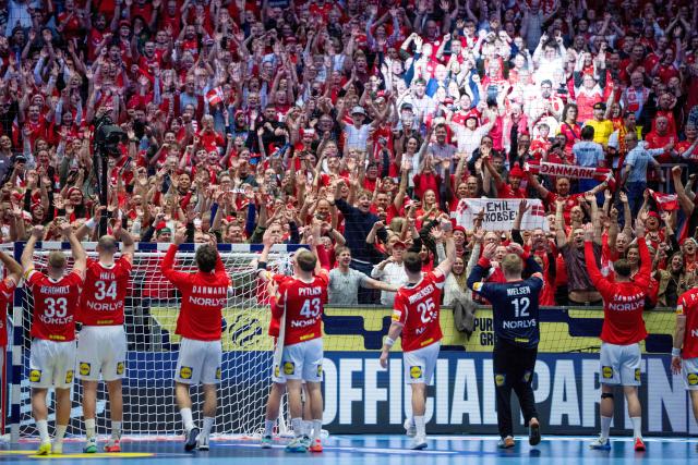 Denmark's players celebrate with their fans after the men's EHF Euro 2026 preliminary round group B handball match Denmark vs North Macedonia in Herning, Denmark, on January 16, 2026. (Photo by Bo Amstrup / Ritzau Scanpix / AFP) / Denmark OUT