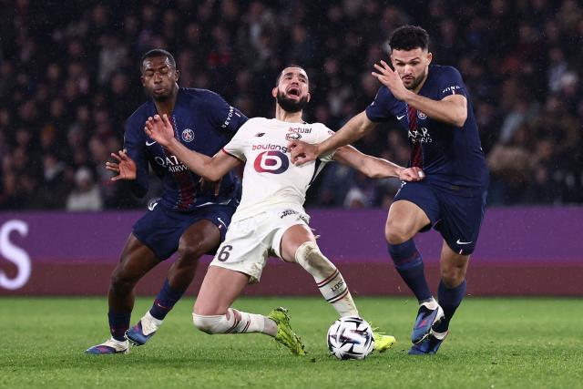 Lille's Algerian midfielder #06 Nabil Bentaleb (C) falls to the ground as he fights for the ball with Paris Saint-Germain's Ecuadoran defender #51 Willian Pacho (L) and Paris Saint-Germain's Portuguese forward #09 Goncalo Ramos (R) during the French L1 football match between Paris Saint-Germain (PSG) and Lille LOSC at the Parc des Princes stadium in Paris on January 16, 2026. (Photo by Anne-Christine POUJOULAT / AFP)