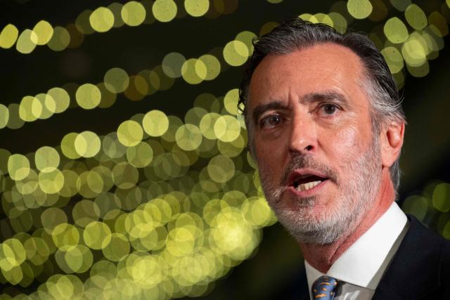 Liberal Initiative Party candidate for Portugal’s presidency, Joao Cotrim Figueiredo, gestures during a campaign dinner in Braga, northern Portugal, on January 16, 2026. Portugal will hold presidential elections on 18 January. (Photo by MIGUEL RIOPA / AFP)