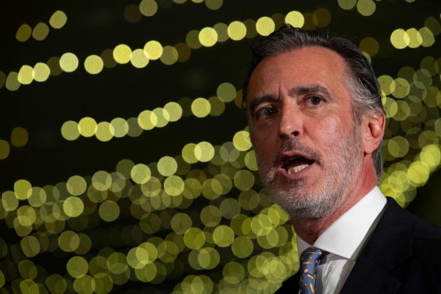 Liberal Initiative Party candidate for Portugal’s presidency, Joao Cotrim Figueiredo, gestures during a campaign dinner in Braga, northern Portugal, on January 16, 2026. Portugal will hold presidential elections on 18 January. (Photo by MIGUEL RIOPA / AFP)