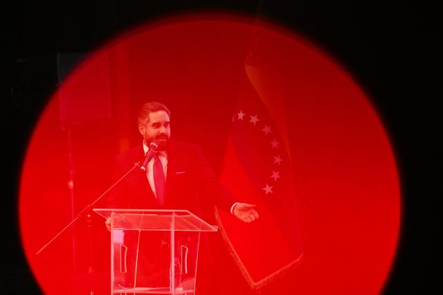 Deputy Nicolas Maduro Guerra, son of ousted President Nicolas Maduro, speaks during a forum organized by the "Network of Lawyers for Maduro and First Lady Cilia Flores" at the Teresa Carreno Theater in Caracas on January 16, 2026. US Central Intelligence Agency chief John Ratcliffe met Venezuela's interim leader Delcy Rodriguez in Caracas on January 15, a US administration official said, in the highest-level American visit since the fall of Nicolas Maduro. (Photo by Federico PARRA / AFP)