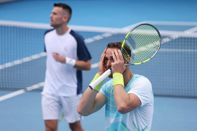 France's Albano Olivetti (R) and Theo Arribage react as they play against Alexander Erler of Austria and the USA’s Robert Galloway in their men's doubles final match at the ATP Auckland Classic tennis tournament in Auckland on January 17, 2026. (Photo by Michael Bradley / AFP)
