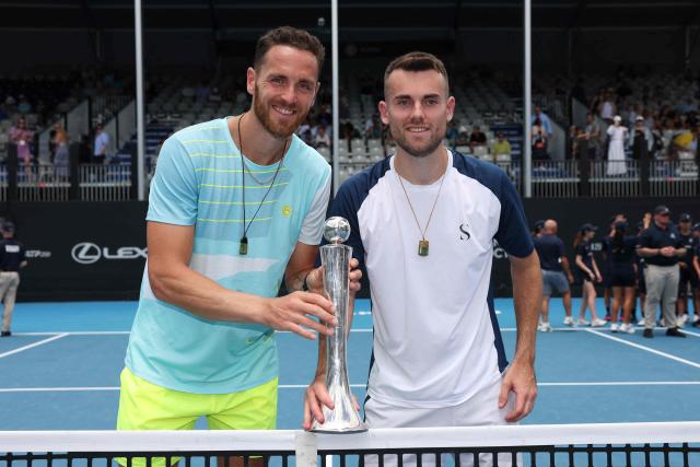 France's Albano Olivetti (L) and Theo Arribage pose with their trophy after their win over against Alexander Erler of Austria and the USA’s Robert Galloway in their men's doubles final match at the ATP Auckland Classic tennis tournament in Auckland on January 17, 2026. (Photo by Michael Bradley / AFP)