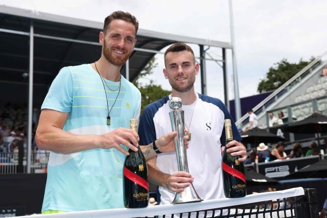 France's Albano Olivetti (L) and Theo Arribage pose with their trophy after their win over against Alexander Erler of Austria and the USA’s Robert Galloway in their men's doubles final match at the ATP Auckland Classic tennis tournament in Auckland on January 17, 2026. (Photo by Michael Bradley / AFP)
