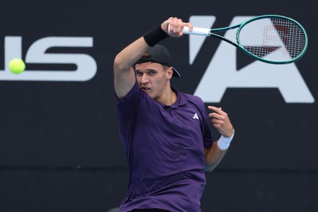 Czech Republic's Jakub Mensik hits a return against Argentina's Sebastian Baez during their men's singles final match at the ATP Auckland Classic tennis tournament in Auckland on January 17, 2026. (Photo by Michael Bradley / AFP)