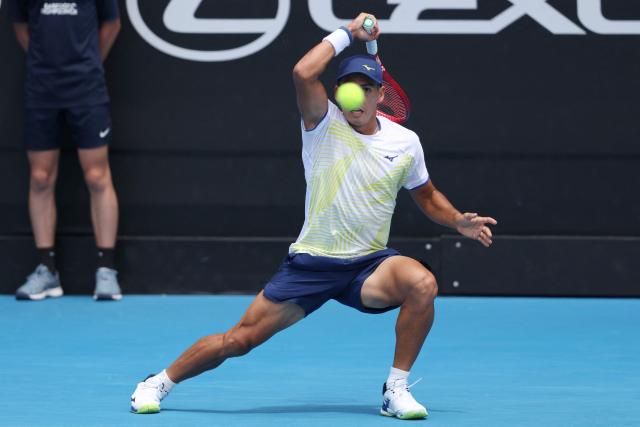 Argentina's Sebastian Baez hits a return against Czech Republic's Jakub Mensik during their men's singles final match at the ATP Auckland Classic tennis tournament in Auckland on January 17, 2026. (Photo by Michael Bradley / AFP)