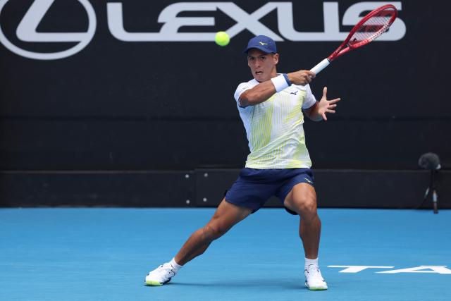 Argentina's Sebastian Baez hits a return against Czech Republic's Jakub Mensik during their men's singles final match at the ATP Auckland Classic tennis tournament in Auckland on January 17, 2026. (Photo by Michael Bradley / AFP)