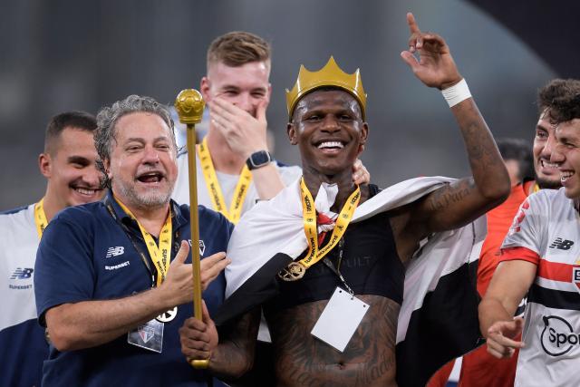 (FILES) President of Sao Paulo Julio Casares (L) and Ecuadorian Robert Arboelda (R) celebrate defeating Palmeiras during the Brazilian Super Cup football final between Palmeiras and Sao Paulo at the Mineirao stadium in Belo Horizonte, Brazil, on February 4, 2024. Brazilian side Sao Paulo dismissed its president, Julio Casares, on January 16, after police opened an investigation into allegations of misappropriation of funds from the institution. (Photo by DOUGLAS MAGNO / AFP)