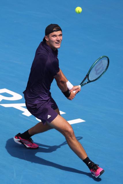 Czech Republic's Jakub Mensik hits a return against Argentina's Sebastian Baez during their men's singles final match at the ATP Auckland Classic tennis tournament in Auckland on January 17, 2026. (Photo by Michael Bradley / AFP)