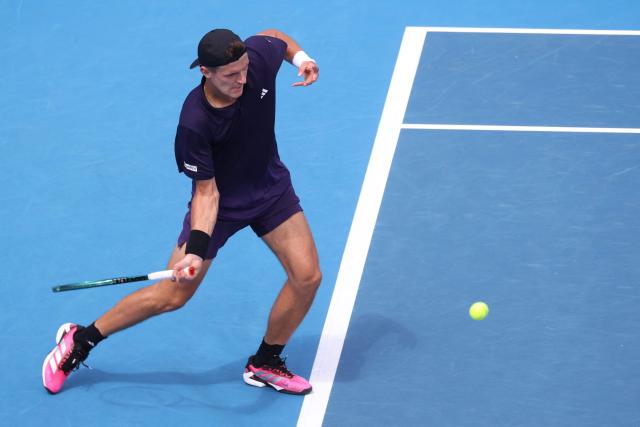 Czech Republic's Jakub Mensik hits a return against Argentina's Sebastian Baez during their men's singles final match at the ATP Auckland Classic tennis tournament in Auckland on January 17, 2026. (Photo by Michael Bradley / AFP)