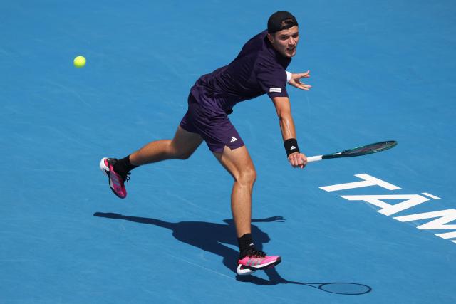 Czech Republic's Jakub Mensik hits a return against Argentina's Sebastian Baez during their men's singles final match at the ATP Auckland Classic tennis tournament in Auckland on January 17, 2026. (Photo by Michael Bradley / AFP)