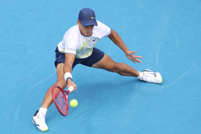 Argentina's Sebastian Baez hits a return against Czech Republic's Jakub Mensik during their men's singles final match at the ATP Auckland Classic tennis tournament in Auckland on January 17, 2026. (Photo by Michael Bradley / AFP)