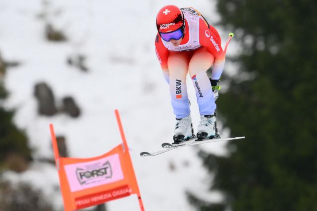Switzerland's Corinne Suter competes during the Women's Downhill event of FIS Alpine Skiing World Cup in Tarvisio, Italy on January 17, 2026. (Photo by Marco BERTORELLO / AFP)