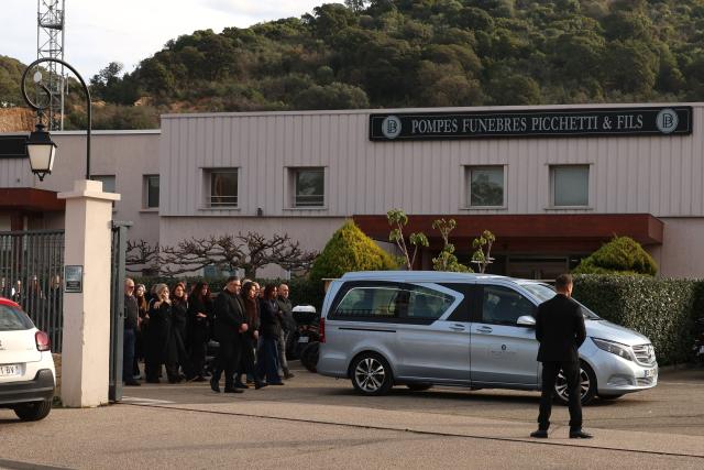 Family members and relatives follow the hearse during the funeral of former Corsican nationalist Alain Orsoni in Ajaccio, on the French Mediterranean Island of Corsica on January 17, 2026. Former Corsican nationalist leader turned businessman and former head of the AC Ajaccio football club, Alain Orsoni, 71, was shot dead on January 12, 2026 while attending his mother's funeral in the small Corsican village of Vero, triggering a new wave of shock across the Island of Corsica, which has been ravaged by internecine conflicts between criminal gangs. (Photo by Pascal POCHARD-CASABIANCA / AFP)