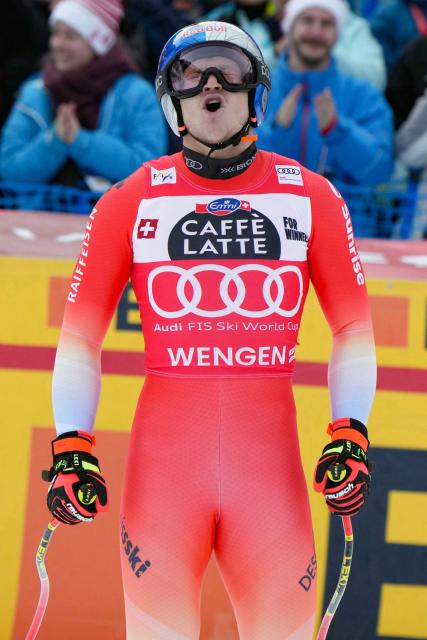 Switzerland's Marco Odermatt reacts in the finish area of the men's Alpine downhill race of the FIS Alpine Skiing World Cup in Wengen, on January 17, 2026. (Photo by Dimitar DILKOFF / AFP)