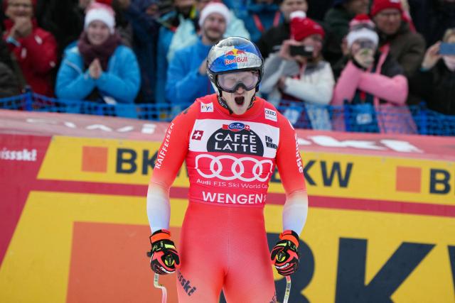 Switzerland's Marco Odermatt reacts in the finish area of the men's Alpine downhill race of the FIS Alpine Skiing World Cup in Wengen, on January 17, 2026. (Photo by Dimitar DILKOFF / AFP)