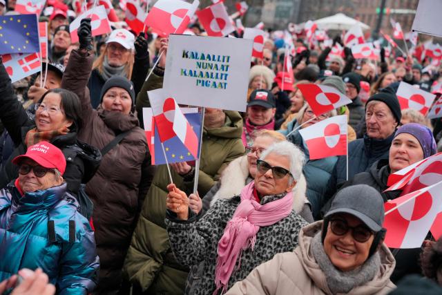 Protesters wave Greenlandic flags as they take part in a rally under the slogans 'hands off Greenland' and 'Greenland for Greenlanders', in front of City Hall in Copenhagen, Denmark on January 17, 2026. (Photo by Emil Helms / Ritzau Scanpix / AFP) / Denmark OUT