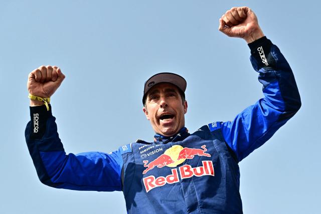 Second placed Ford Racing’s Spanish driver Nani Roma celebrates at the end of the 48th edition of the Dakar Rally 2026 in Yanbu, Saudi Arabia, on January 17, 2026. (Photo by Giuseppe CACACE / AFP)