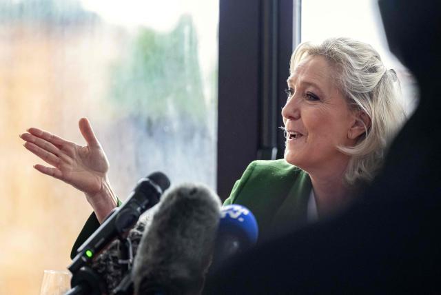 President of Rassemblement National parliamentary group Marine Le Pen gestures next to French Rassemblement National (RN) party's candidate for the mayor of Marseille as she addresses media during a press conference in Marseille, southern France on January 17, 2026. (Photo by MIGUEL MEDINA / AFP)
