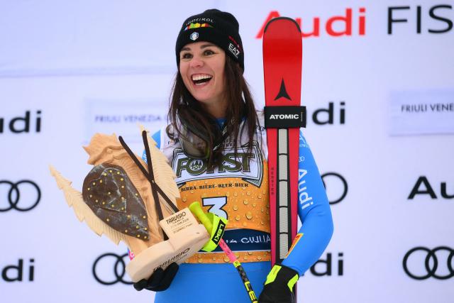 Italy's Nicol Delago, winner, celebrates on the podium of the Women's Downhill event of FIS Alpine Skiing World Cup in Tarvisio, Italy on January 17, 2026. Italy's Nicol Delago won the race ahead of Germany's Kira Weidle, second, and US' Lindsey Vonn, third. (Photo by Marco BERTORELLO / AFP)