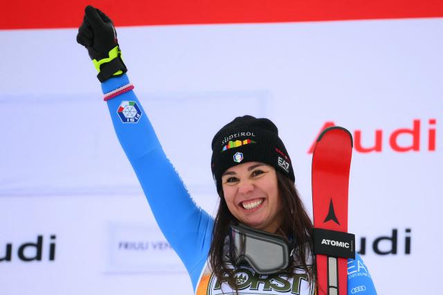 Italy's Nicol Delago, winner, celebrates on the podium of the Women's Downhill event of FIS Alpine Skiing World Cup in Tarvisio, Italy on January 17, 2026. Italy's Nicol Delago won the race ahead of Germany's Kira Weidle, second, and US' Lindsey Vonn, third. (Photo by Marco BERTORELLO / AFP)