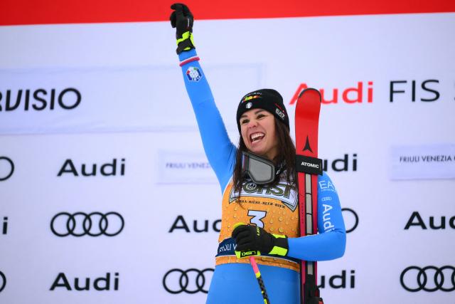 Italy's Nicol Delago, winner, celebrates on the podium of the Women's Downhill event of FIS Alpine Skiing World Cup in Tarvisio, Italy on January 17, 2026. Italy's Nicol Delago won the race ahead of Germany's Kira Weidle, second, and US' Lindsey Vonn, third. (Photo by Marco BERTORELLO / AFP)