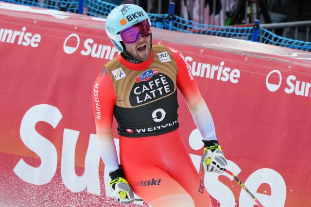 Switzerland's Alexis Monney reacts in the finish area of the men's Alpine downhill race of the FIS Alpine Skiing World Cup in Wengen, on January 17, 2026. (Photo by Dimitar DILKOFF / AFP)