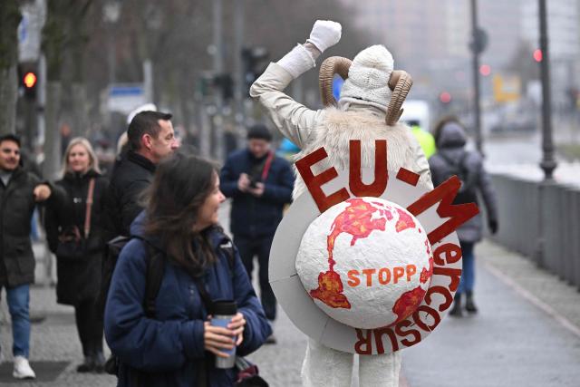 A protester calls for a stop to the EU–Mercosur  Agreement as they take part in a demonstration titled "We are fed up!" and demanding a socially just agricultural transition, in Berlin on January 17, 2026. (Photo by RALF HIRSCHBERGER / AFP)