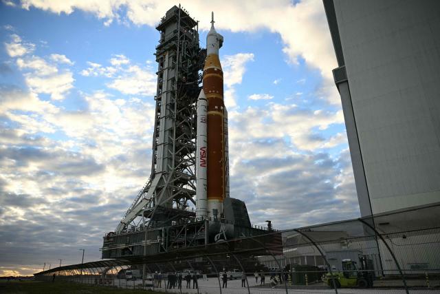 NASA's Artemis II Space Launch System rocket and Orion spacecraft are rolled out of the Vehicle Assembly Building to Launch Pad 39B at Kennedy Space Center in Florida on January 17, 2026, ahead of the crewed lunar mission. (Photo by Jim WATSON / AFP)