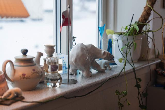 Ornaments including a polarbear are on displat at Ulrikke Andersen (not in Picture), a 40-year-old tour operator's home in Nuuk, Greenland on January 16, 2026. Ulrikke Andersen says she will plan to leave Greenland in the case of a war or US invasion as US President Donald Trump's designs to take over the Arctic island who no signs of letting up. (Photo by Alessandro RAMPAZZO / AFP)