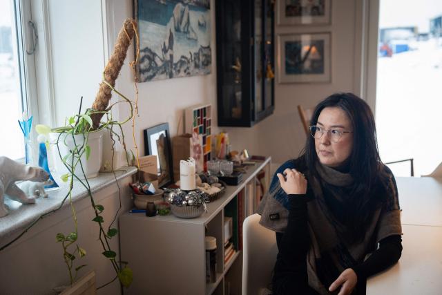 Ulrikke Andersen, a 40-year-old tour operator is pictured at her home in Nuuk, Greenland on January 16, 2026. Ulrikke Andersen says she will plan to leave Greenland in the case of a war or US invasion as US President Donald Trump's designs to take over the Arctic island who no signs of letting up. (Photo by Alessandro RAMPAZZO / AFP)