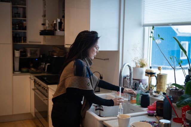 Ulrikke Andersen, a 40-year-old tour operator is pictured at her home in Nuuk, Greenland on January 16, 2026. Ulrikke Andersen says she will plan to leave Greenland in the case of a war or US invasion as US President Donald Trump's designs to take over the Arctic island who no signs of letting up. (Photo by Alessandro RAMPAZZO / AFP)