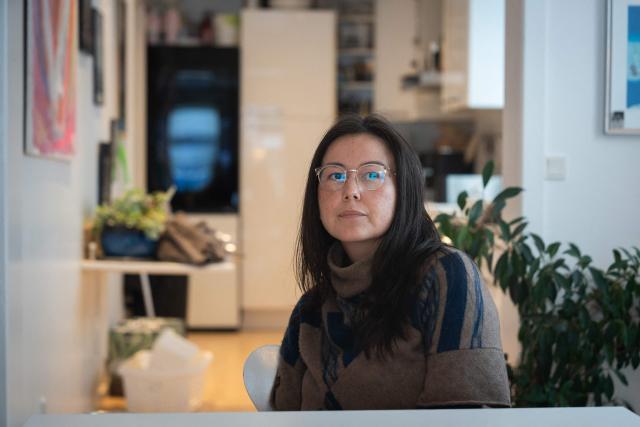 Ulrikke Andersen, a 40-year-old tour operator is pictured at her home in Nuuk, Greenland on January 16, 2026. Ulrikke Andersen says she will plan to leave Greenland in the case of a war or US invasion as US President Donald Trump's designs to take over the Arctic island who no signs of letting up. (Photo by Alessandro RAMPAZZO / AFP)