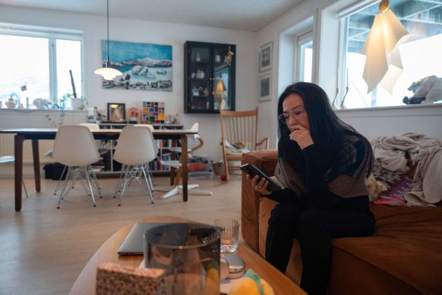 Ulrikke Andersen, a 40-year-old tour operator is pictured at her home in Nuuk, Greenland on January 16, 2026. Ulrikke Andersen says she will plan to leave Greenland in the case of a war or US invasion as US President Donald Trump's designs to take over the Arctic island who no signs of letting up. (Photo by Alessandro RAMPAZZO / AFP)