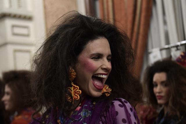 A model gets prepared backstage before designer Rocio Olmedo's show during the XIV edition of the We Love Flamenco fashion show in Seville on January 16, 2026. (Photo by CRISTINA QUICLER / AFP)