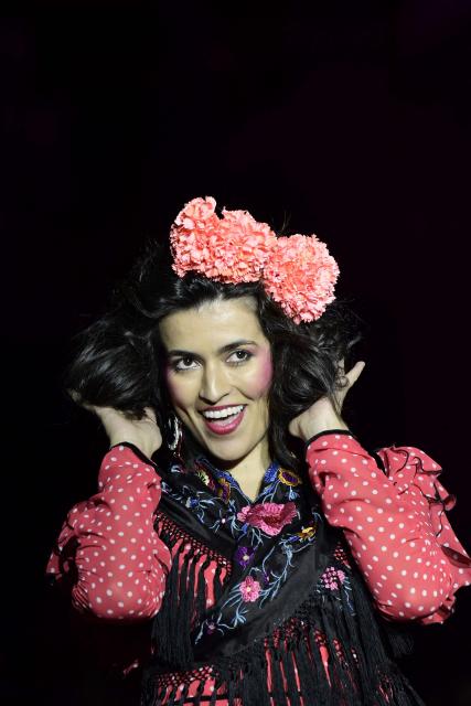 A model showcases a design by Rocio Olmedo during the XIV edition of the We Love Flamenco fashion show in Seville on January 16, 2026. (Photo by CRISTINA QUICLER / AFP)