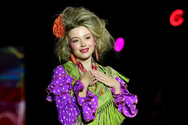 A model showcases a design by Rocio Olmedo during the XIV edition of the We Love Flamenco fashion show in Seville on January 16, 2026. (Photo by CRISTINA QUICLER / AFP)