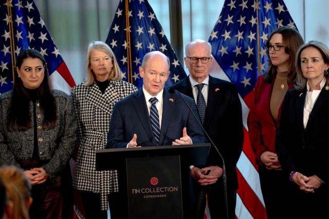 US Democratic Senator Chris Coons (C) addresses a press conference with an American delegation, consisting of senators and members of the House of Representatives, in Copenhagen, on January 17, 2026. A bipartisan US Congress delegation visited Copenhagen to voice support for Denmark and Greenland, insisting that US President Donald Trump's designs on the Arctic island did not have the backing of the American people. The two-day visit comes alongside a European show of support in the form of a military reconnaissance mission to Greenland, a Danish autonomous territory. (Photo by Ida Marie Odgaard / Ritzau Scanpix / AFP) / Denmark OUT