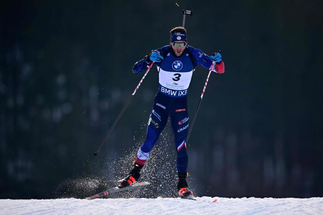 France's Emilien Claude competes during the men's sprint competition of the IBU Biathlon World Cup in Ruhpolding, southern Germany on January 17, 2026. (Photo by Tobias SCHWARZ / AFP)