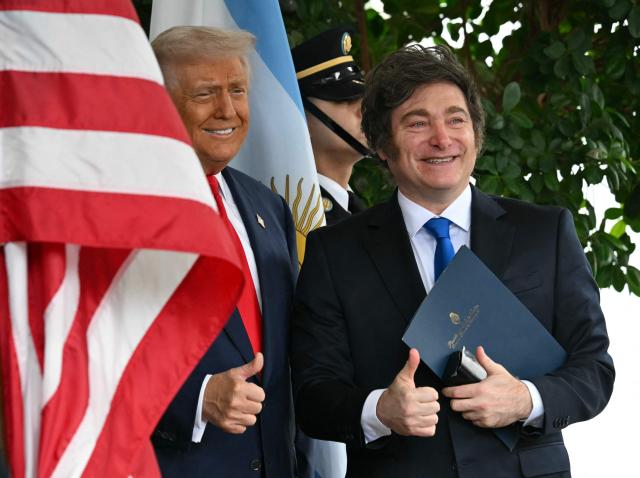 (FILES) US President Donald Trump greets Argentina's President Javier Milei at the White House in Washington, DC on October 14, 2025. Argentine President Javier Milei announced on January 17, 2026, that he received an invitation from US President Donald Trump to join as a founding member of the 'Board of Peace' for Gaza that was announced on January 15. (Photo by ANDREW CABALLERO-REYNOLDS / AFP)